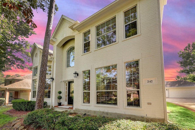 view of front of home featuring brick siding