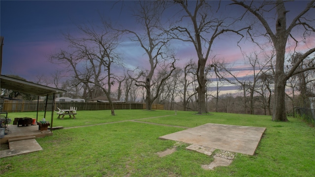 602 Riveredge Dr, Richmond, TX 77406 - yard at dusk featuring a patio and a fenced backyard