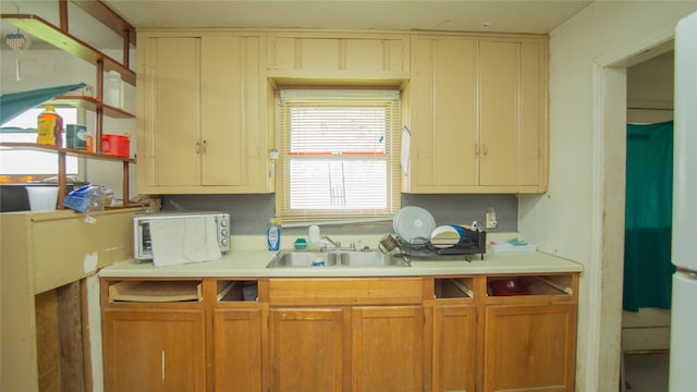602 Riveredge Dr, Richmond, TX 77406 - kitchen featuring light countertops and a sink