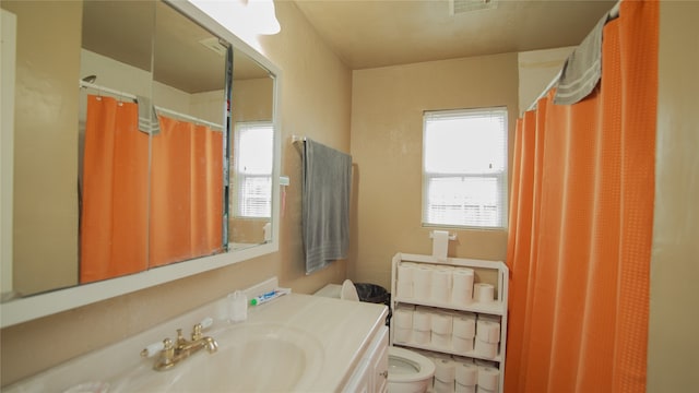602 Riveredge Dr, Richmond, TX 77406 - bathroom featuring visible vents, toilet, and vanity