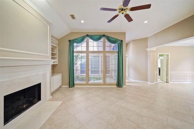 unfurnished living room featuring visible vents, a tiled fireplace, built in features, vaulted ceiling, and a ceiling fan