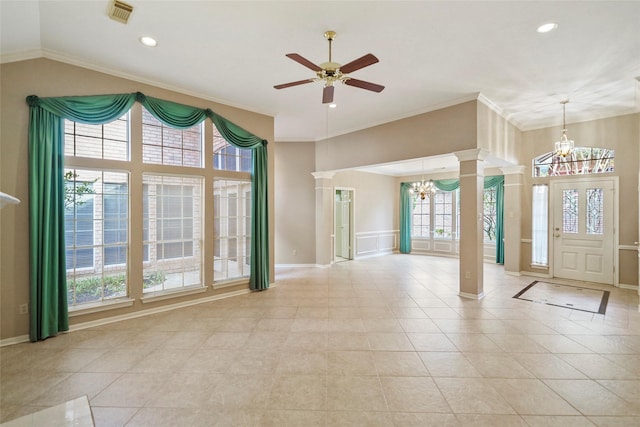 foyer featuring decorative columns, visible vents, ornamental molding, and ceiling fan with notable chandelier