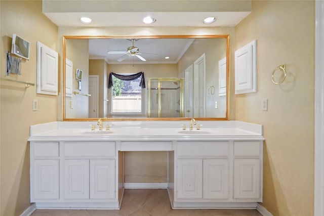 full bath featuring a sink, a stall shower, double vanity, and ceiling fan