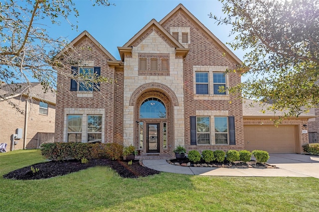 view of front of home with stone siding, concrete driveway, an attached garage, a front yard, and brick siding