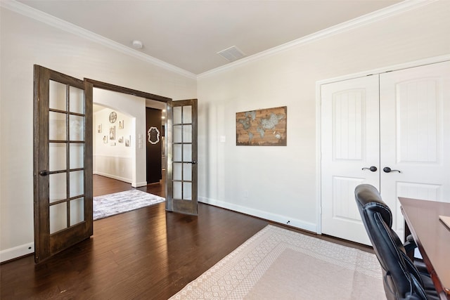 unfurnished office with visible vents, french doors, dark wood-type flooring, and crown molding