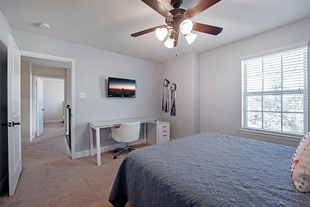 bedroom with baseboards, light colored carpet, and ceiling fan