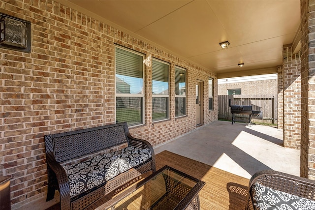 view of patio featuring a grill