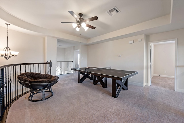 playroom featuring visible vents, carpet floors, a raised ceiling, and baseboards