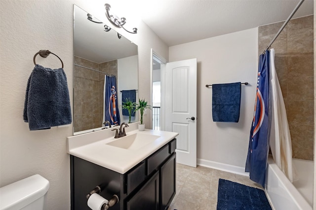 full bath with vanity, baseboards, shower / bath combo, tile patterned floors, and toilet