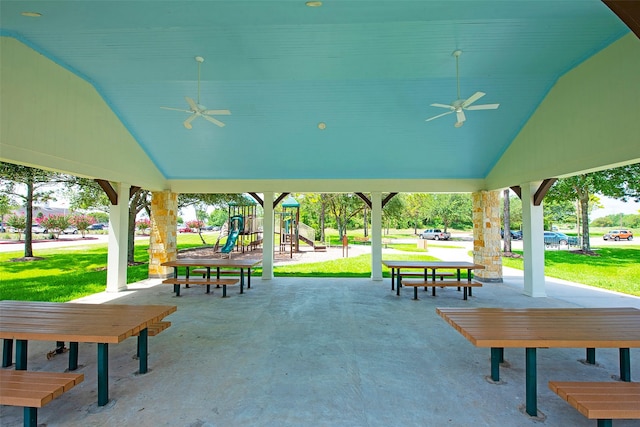 view of home's community featuring a lawn and playground community