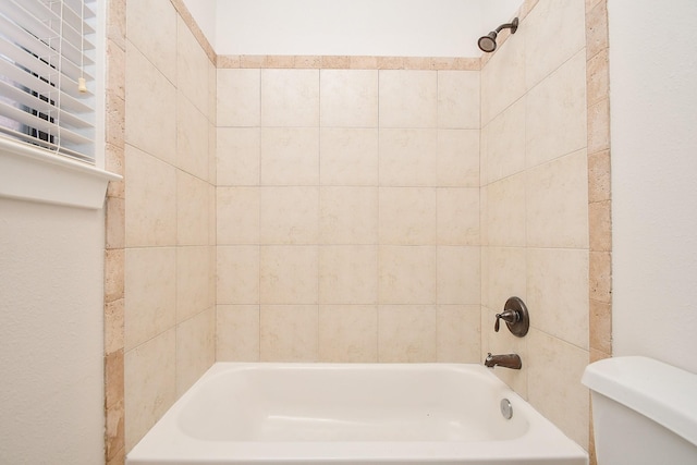 full bathroom featuring bathtub / shower combination and toilet