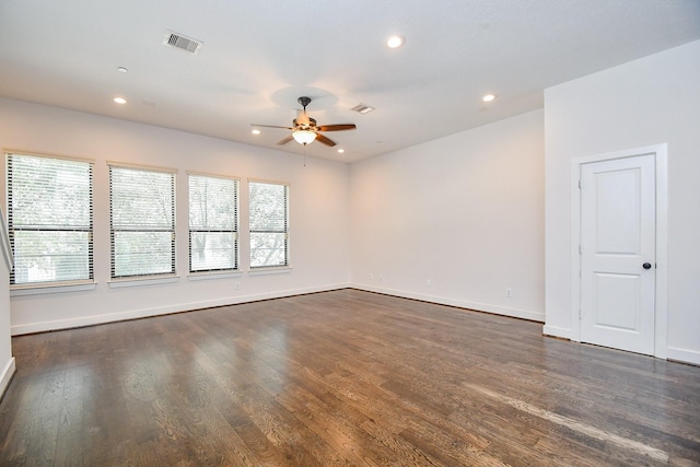 spare room with recessed lighting, visible vents, dark wood-type flooring, and a ceiling fan