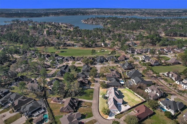 bird's eye view with a residential view and a water view