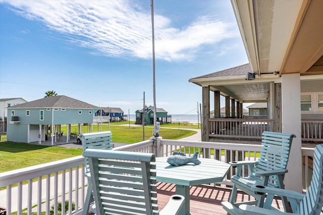 deck with a lawn and a residential view