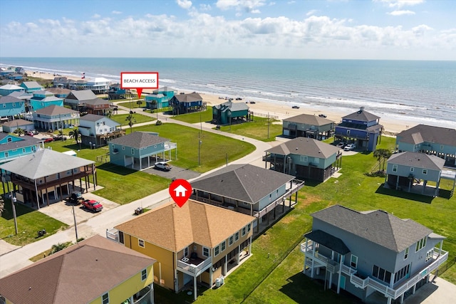 bird's eye view featuring a beach view, a residential view, and a water view