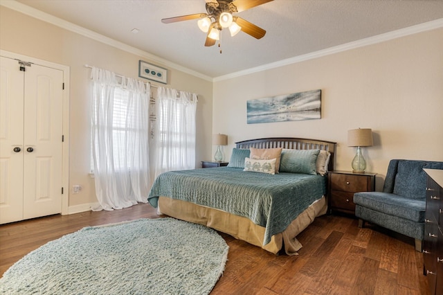 bedroom featuring crown molding, ceiling fan, and wood finished floors