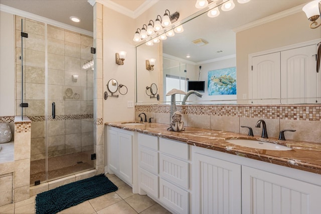 bathroom with a sink, tasteful backsplash, and crown molding