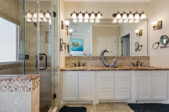 full bathroom featuring tile patterned flooring, crown molding, tasteful backsplash, and a stall shower