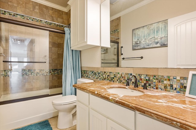 bathroom featuring crown molding, toilet, shower / bath combo, decorative backsplash, and vanity