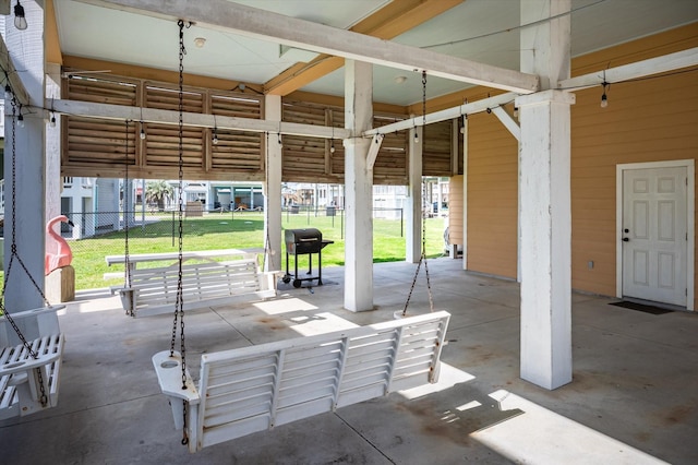 view of patio with grilling area and fence