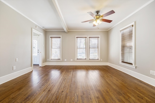 empty room featuring dark wood-style floors, baseboards, a ceiling fan, and ornamental molding