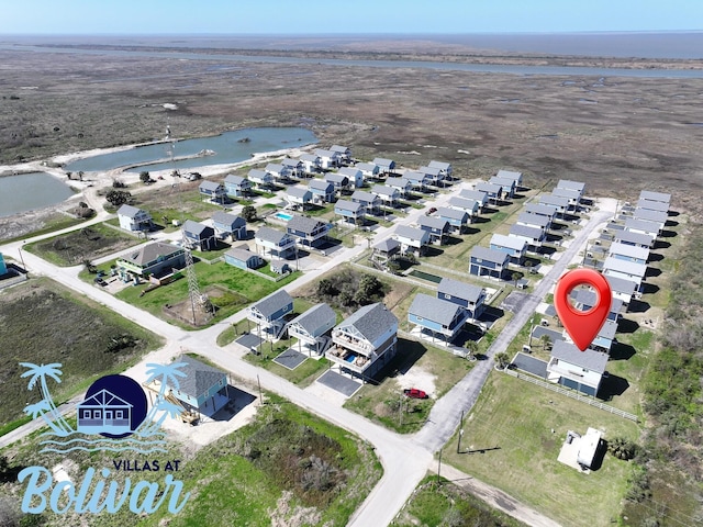 birds eye view of property with a residential view and a water view