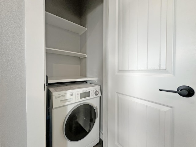 washroom featuring washer / clothes dryer and laundry area