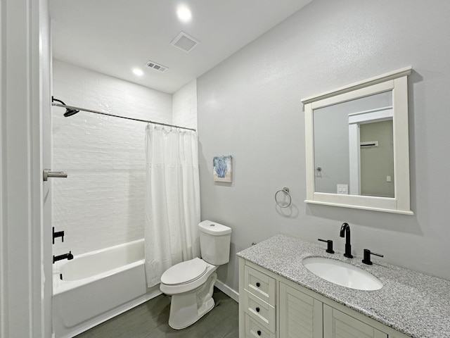 bathroom with visible vents, shower / bathtub combination with curtain, toilet, and vanity