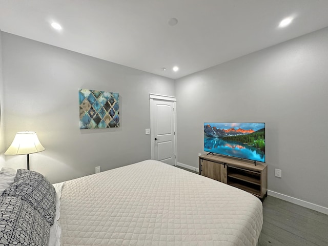 bedroom featuring recessed lighting, baseboards, and wood finished floors