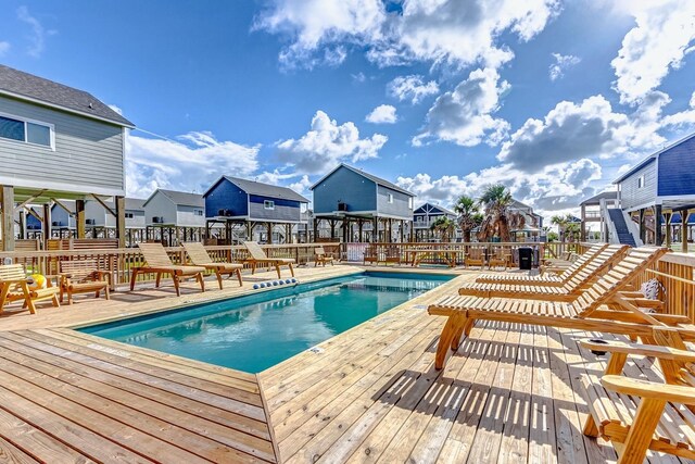 1040 Johnson Rd, Gilchrist, TX 77617 - pool with a residential view and a wooden deck