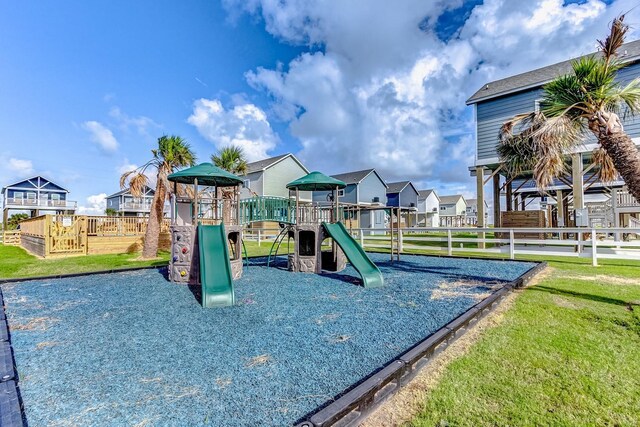 1040 Johnson Rd, Gilchrist, TX 77617 - communal playground with a residential view, fence, and a yard