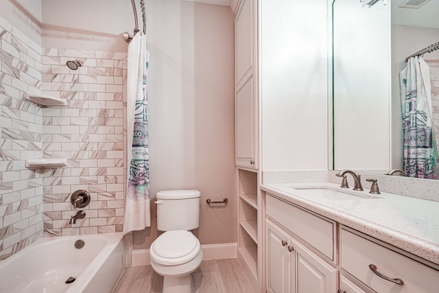 full bathroom with toilet, shower / bath combo, wood finished floors, baseboards, and vanity