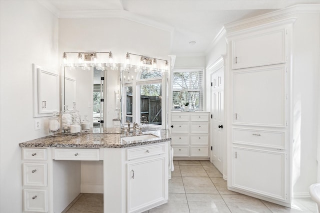 bathroom with vanity, tile patterned floors, and ornamental molding