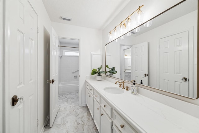 bathroom with visible vents, marble finish floor, shower / tub combination, a textured ceiling, and vanity