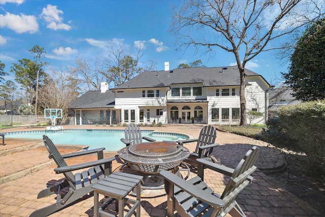 view of swimming pool featuring a patio area and a fenced in pool