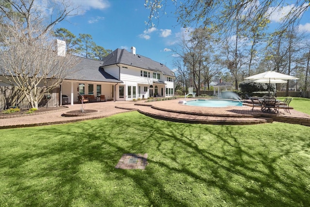 view of yard with a patio and an outdoor pool