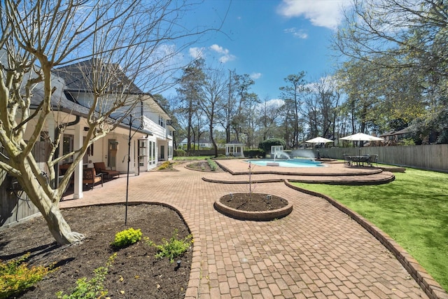 view of yard with a patio, a fenced backyard, and a fenced in pool