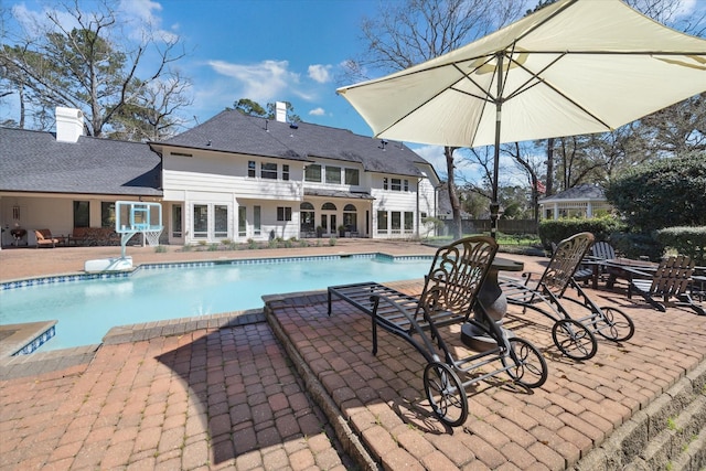 view of swimming pool featuring a fenced in pool and a patio area