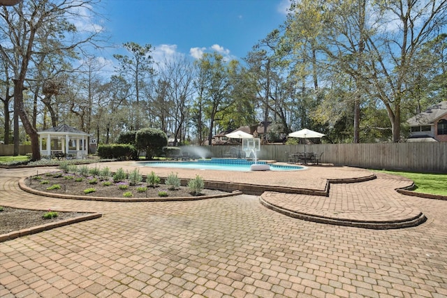 view of pool featuring a gazebo and fence