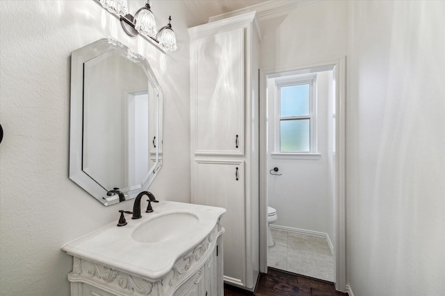 bathroom with vanity and toilet