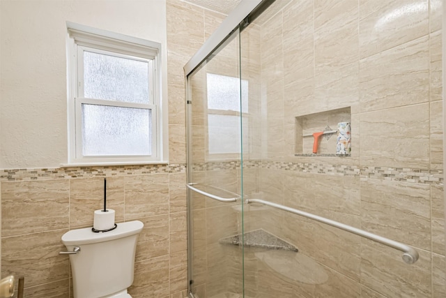 full bathroom with toilet and a stall shower