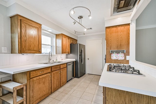 kitchen with visible vents, a sink, stainless steel appliances, brown cabinetry, and light tile patterned floors