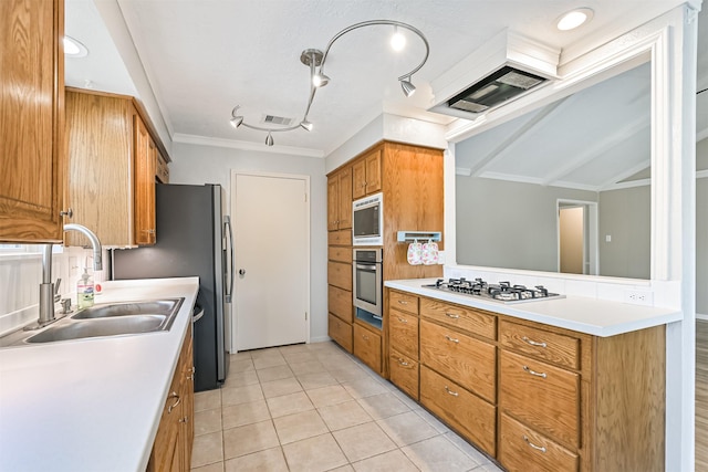 kitchen with visible vents, light countertops, brown cabinets, stainless steel appliances, and a sink