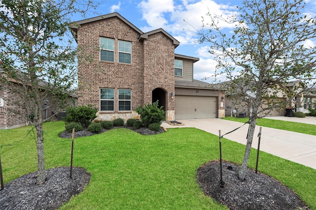 traditional home with a front lawn, an attached garage, brick siding, and driveway