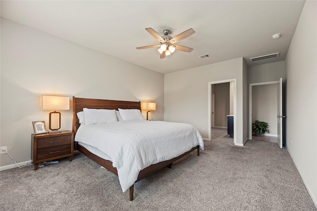 bedroom with visible vents, baseboards, light colored carpet, and a ceiling fan