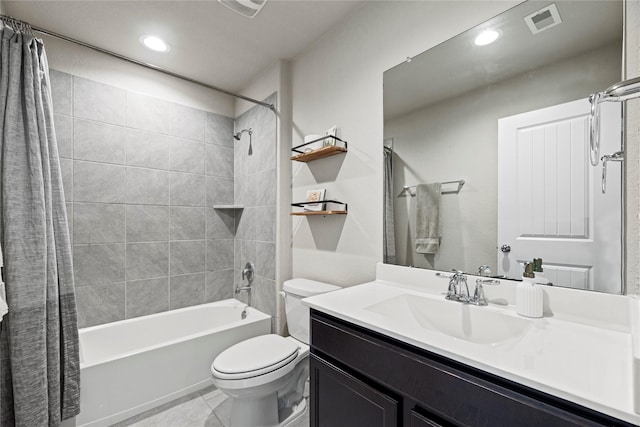 bathroom with vanity, visible vents, shower / tub combo, tile patterned floors, and toilet