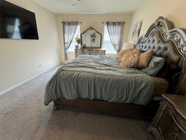 bedroom with baseboards and carpet floors