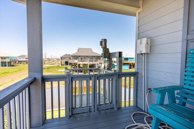 wooden deck featuring a residential view