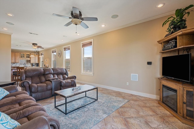 living room featuring recessed lighting, visible vents, baseboards, and crown molding