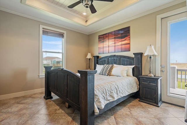 bedroom featuring ceiling fan, a raised ceiling, baseboards, and ornamental molding